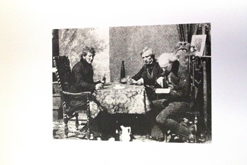 Three gentlemen at a table in Claudet's Studio